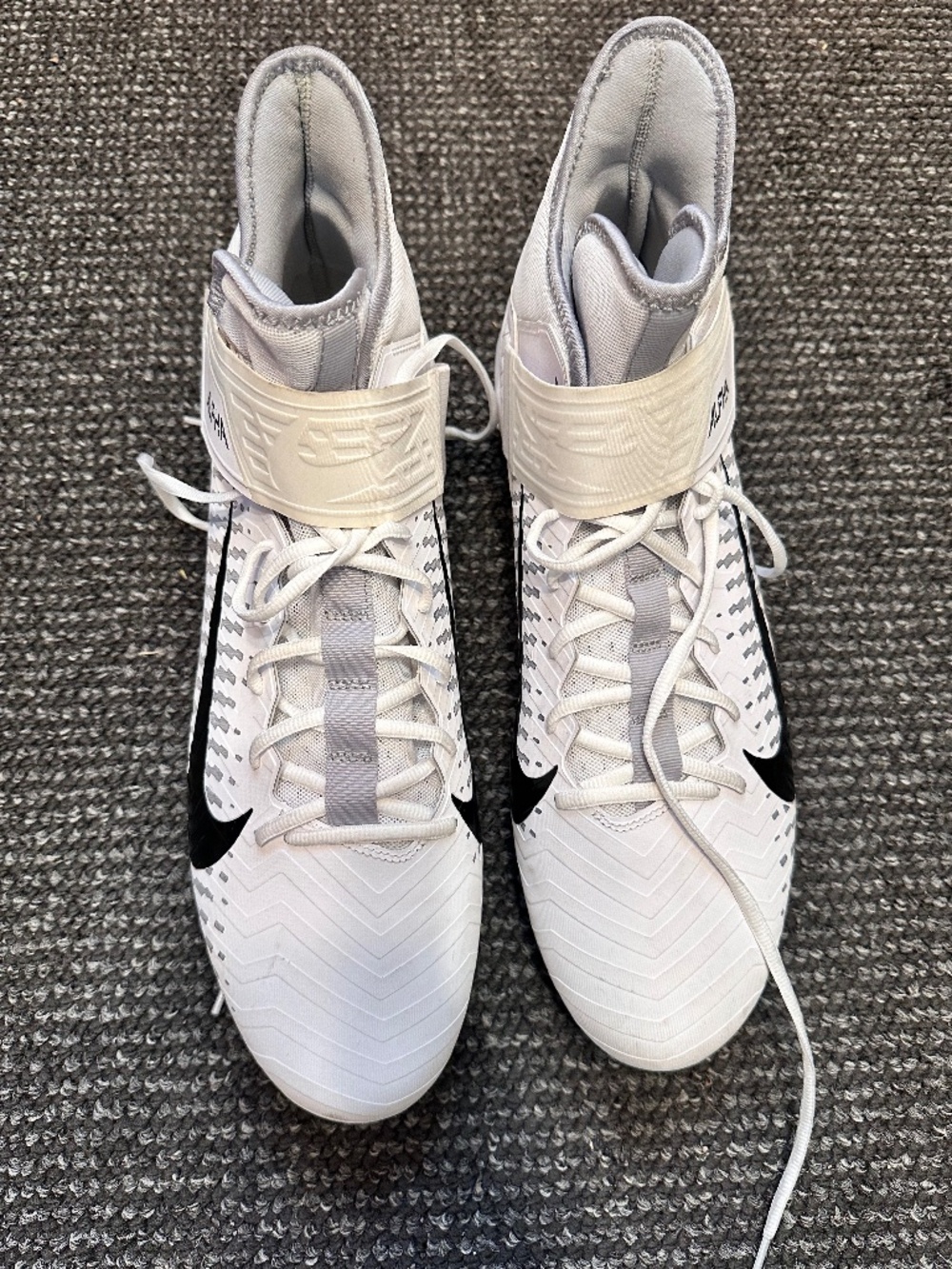 Nike Alpha Menace Pro 2 Mid football cleats in a white/black colorway, featu
